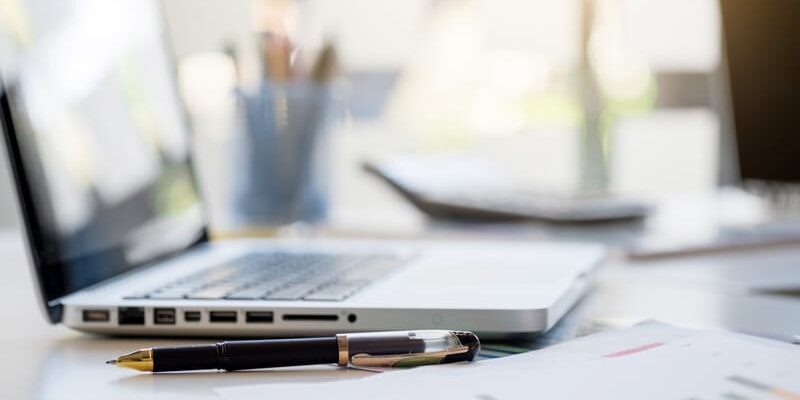 Source-Business-Finance-with-Confidence-laptop-south-west-business-finance laptap on desktop to depitct the Source Business Finance with Confidence